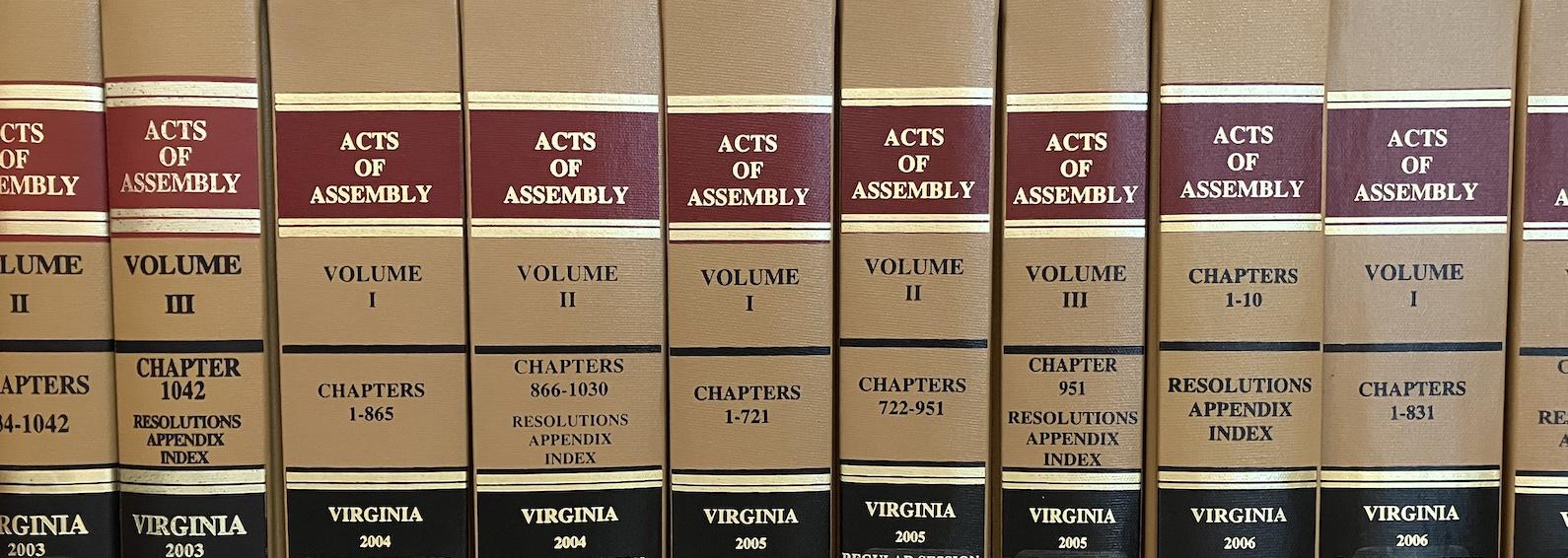 Images shows the spines of ten copies of the Virginia Acts of Assembly.